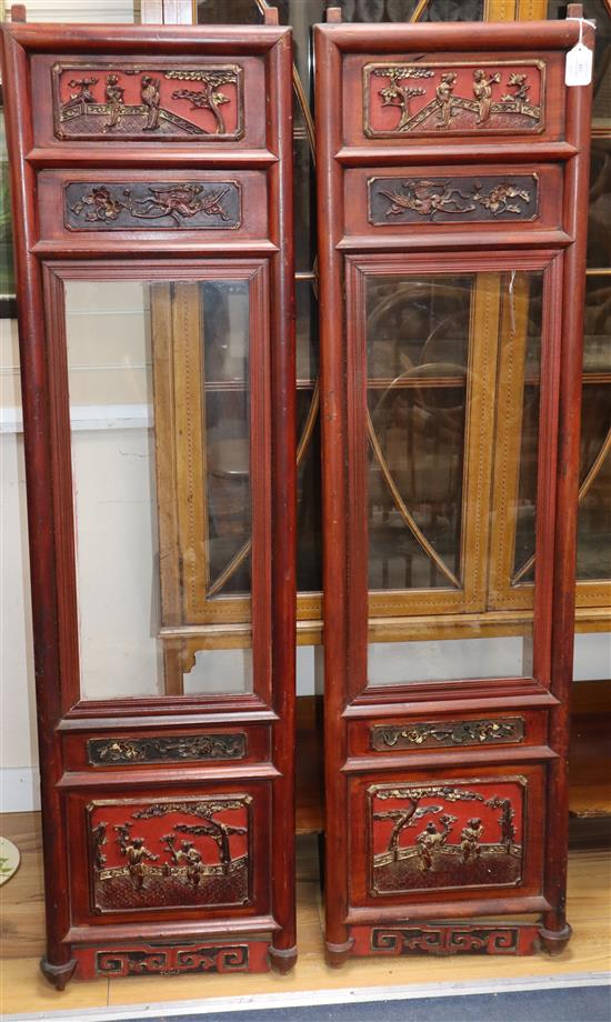 A pair of 19th century Chinese carved wood and glazed panels W.40cm